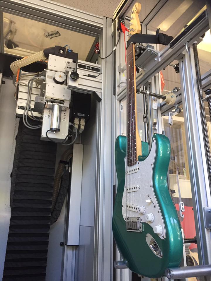 guitar in plek machine